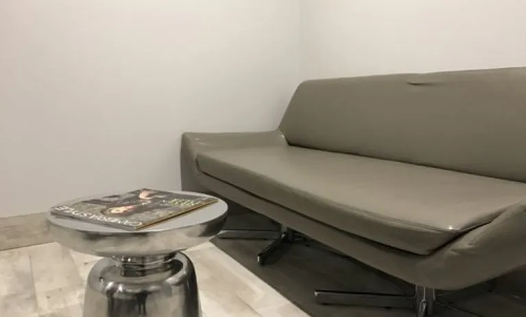 Sofa inside day use room at Ramsey Inn & Suites.