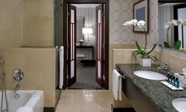 Guest bathroom with shower and bath at Sofitel Philadelphia At Rittenhouse Square.