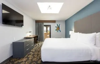 King room with TV at Regency Miami Airport By Sonesta.