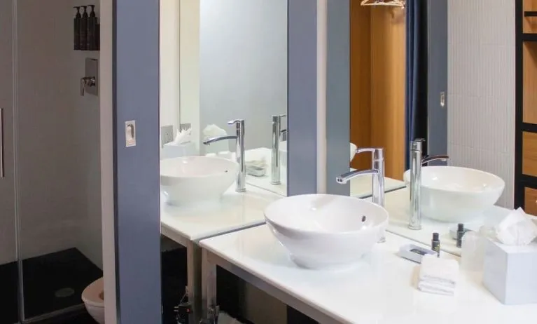 Guest bathroom with shower at Aloft Miami Doral.

