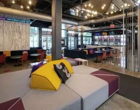 Lobby and seating area at Aloft Miami Doral.
