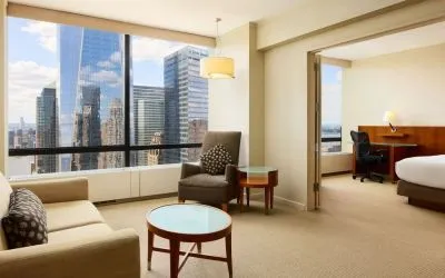 Luxurious king suite with lounge area at Millennium Downtown New York.