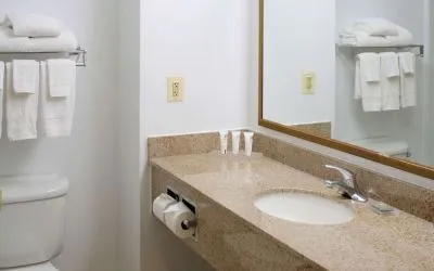 Bathroom with shower at Country Inn & Suites By Radisson, BWI Airport.