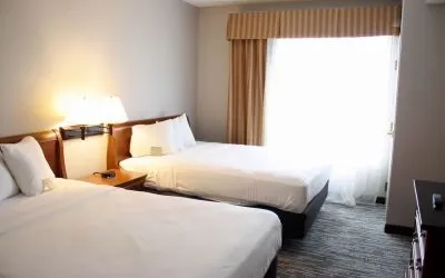 Spacious day room with two queen beds at Country Inn & Suites By Radisson, BWI Airport.