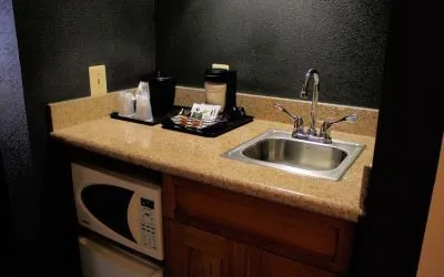 King room with kitchen area at Country Inn & Suites By Radisson, BWI Airport.
