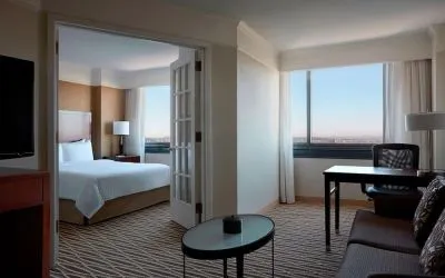 Spacious king suite with lounge area at Washington Dulles Marriott Suites.