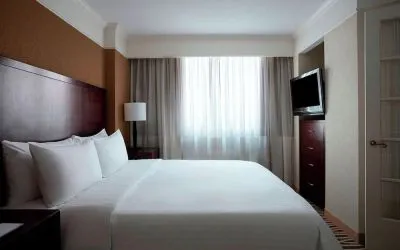 Romantic king room with TV at Washington Dulles Marriott Suites.