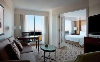 Spacious day use room with lounge and TV at Washington Dulles Marriott Suites.