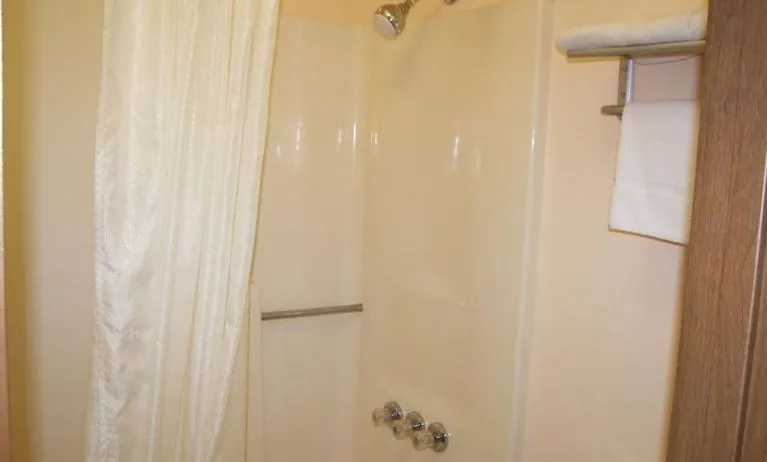 Guest bathroom with shower at Stardust Motel Redding.
