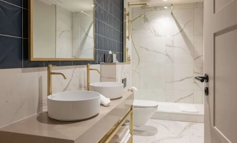 Guest bathroom with shower at DoubleTree By Hilton Brighton Metropole.