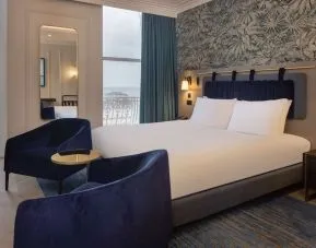 King room with lounge seating at DoubleTree By Hilton Brighton Metropole.