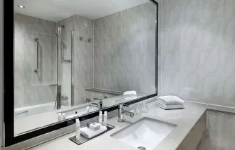 Guest bathroom with shower at DoubleTree By Hilton Woking.