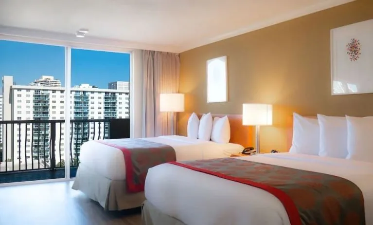 Two queen beds at Ramada Plaza Marco Polo Beach Resort.