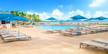 Relaxing pool area at Ramada Plaza Marco Polo Beach Resort.