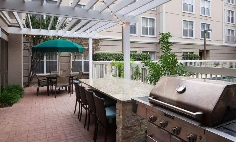 Outdoor barbeque area at Homewood Suites By Hilton Austin NW Near The Domain.