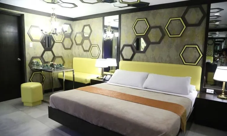 Simple king room at Victoria Court Las Piñas.