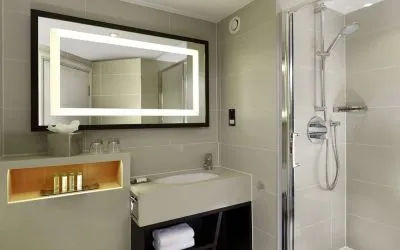 Guest bathroom with shower at DoubleTree By Hilton London - Ealing.