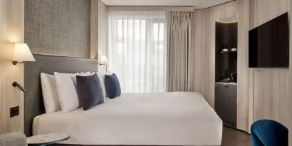 Elegant day room with natural light at The Westminster London, Curio Collection By Hilton.  