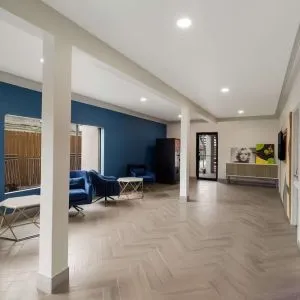 Lobby and coworking space at Signature Inn Houston Galleria.