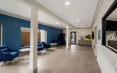 Lobby and coworking space at Signature Inn Houston Galleria.