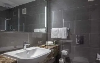 Guest bathroom with shower at DoubleTree By Hilton Bristol City Centre.
