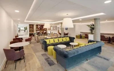 Coworking space and lounge at Hampton By Hilton London Stansted Airport.