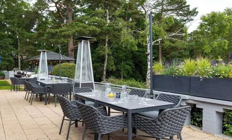 Outdoor dining area at Hilton Cobham.
