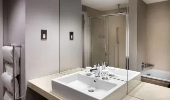 Guest bathroom with shower at Doubletree by Hilton Glasgow Central.