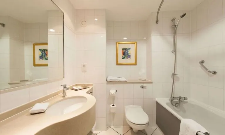 Guest bathroom with shower at Doubletree by Hilton Glasgow Strathclyde. 