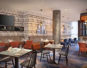 Dining area perfect for coworking at Leonardo Hotel Exeter.
