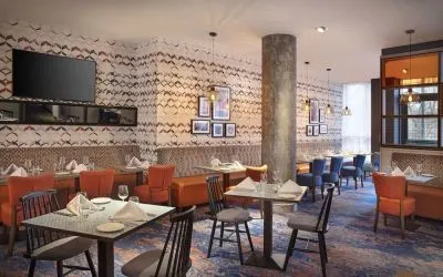Dining area perfect for coworking at Leonardo Hotel Exeter.