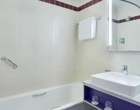 Guest bathroom with shower at Leonardo Hotel Exeter.