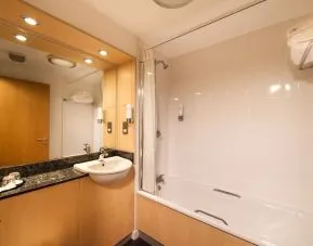 Guest bathroom with shower at Leonardo Inn Aberdeen Airport.
