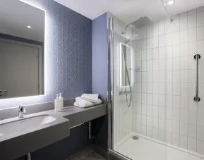 Guest bathroom with shower at Leonardo Hotel Bristol City.
