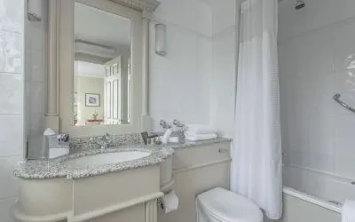 Guest bathroom with shower and tub at The Grand Brighton. 