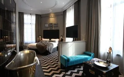Day use room with high ceilings and deep soaking bathtub at Hotel Gotham.