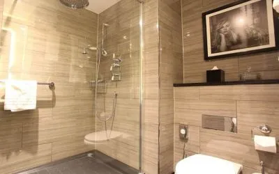 Guest bathroom with shower at Hotel Gotham.  