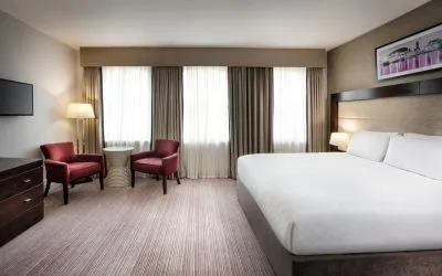 King bed with TV at Leonardo Hotel Cardiff.