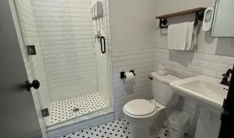 Guest bathroom with shower at Tribeca Hotel FiDi.