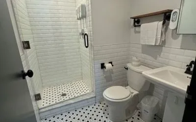 Guest bathroom with shower at Tribeca Hotel FiDi.