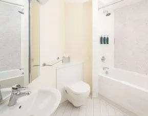Guest bathroom with shower and tub at Hilton Northampton.