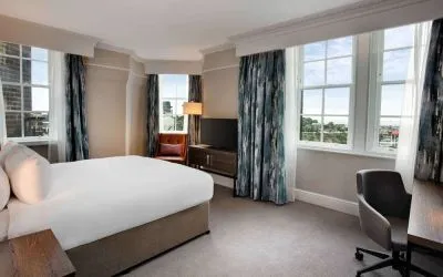 Day use room with large windows and work desk at Hilton Edinburgh Carlton.