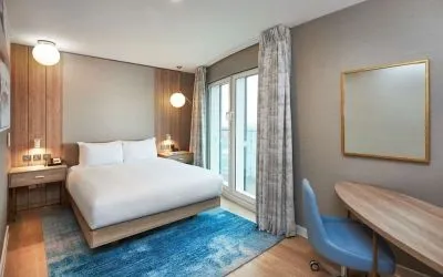 Day use room with work desk and balcony at DoubleTree By Hilton London Excel.