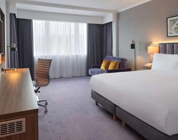 King bedroom with work desk at DoubleTree By Hilton Edinburgh Airport.