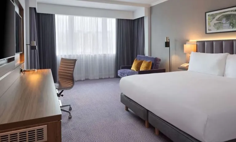 King bedroom with work desk at DoubleTree By Hilton Edinburgh Airport.