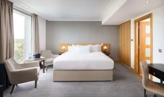 Day use guestroom with work desk and lounge area at the Hilton London Gatwick Airport.