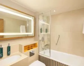 Guest bathroom with shower and tub at DoubleTree By Hilton London - Hyde Park.