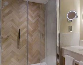 Guest bathroom with shower and toiletries at the DoubleTree by Hilton Bristol North.