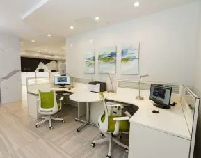 Business center with computers, ergonomic chairs and printer at Executive Residency By Best Western.
