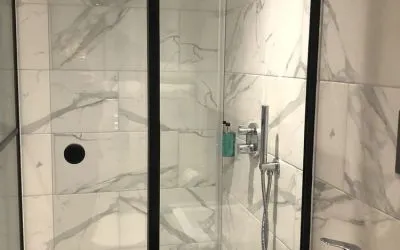 Guest bathroom with shower at Euston Square Hotel.